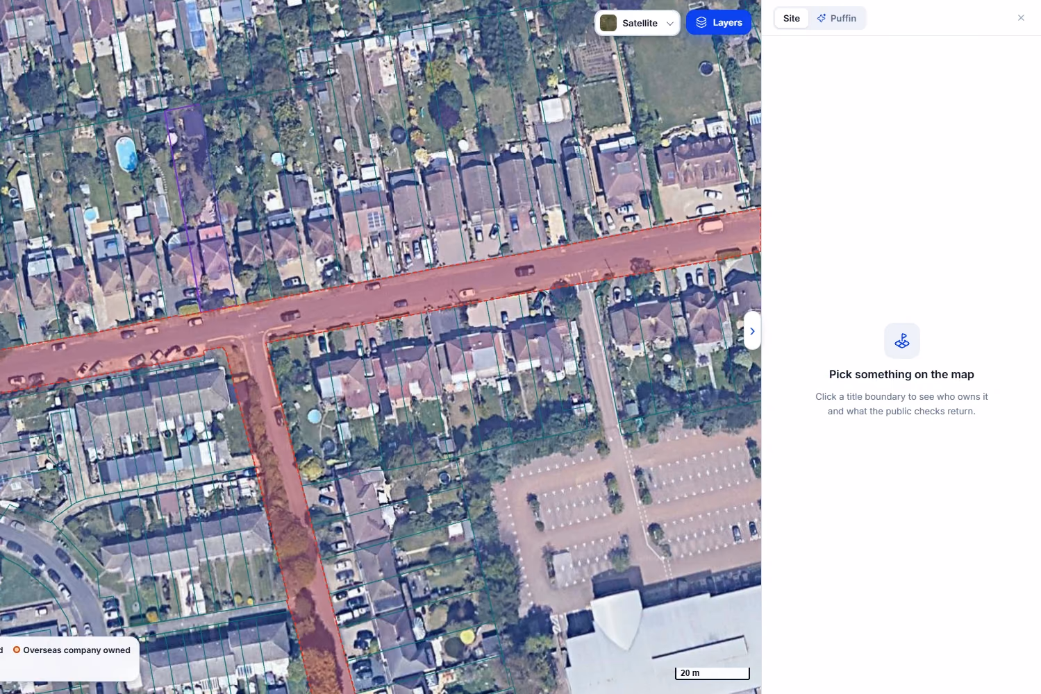 Satellite map of Staines-upon-Thames with title outlines on. One long, narrow plot behind Wheatsheaf Lane is outlined in purple, the colour for UK company ownership, and the road is shaded red as land with no mapped freehold title.